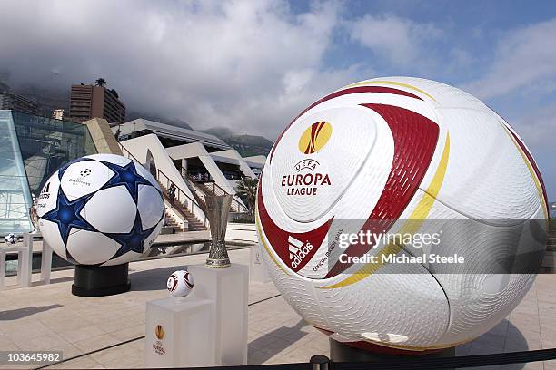 Adidas balls on show alongside the three main European club trophies, the Champions League, Europa League and Super Cup during the UEFA Champions...