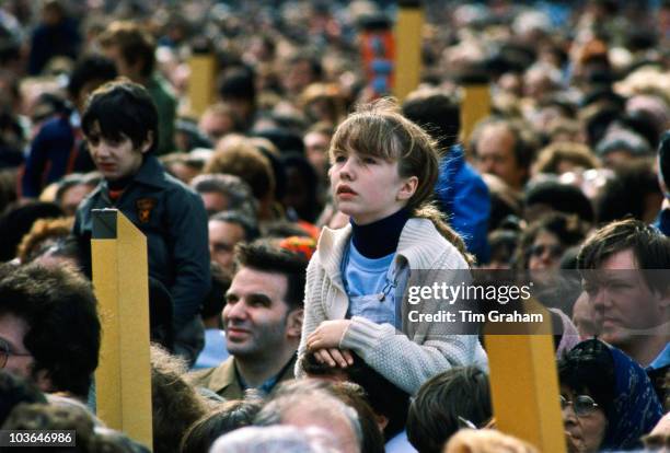 Child among pilgrims gathered in Paris for visit by Pope John Paul II to France