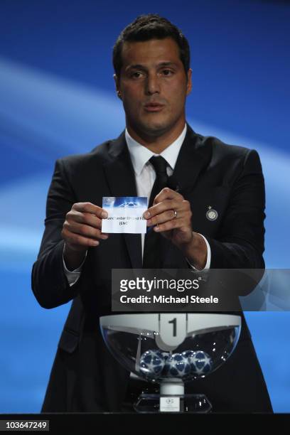 Julio Cesar of Inter Milan and Brazil draws the name of Manchester United during the UEFA Champions League Group Stage draw at the Grimaldi Forum on...