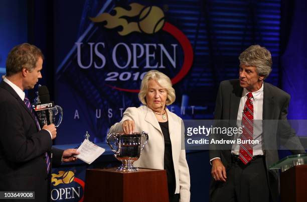Former professional tennis player Patrick McEnroe, USTA President Lucy Garvin and U.S. Open Referee Brian Earley participate in the Draw Ceremony...