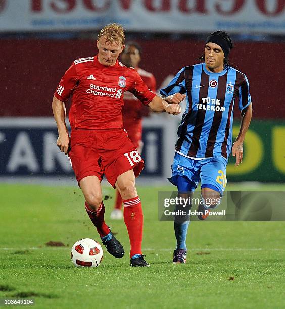 Dirk Kuyt of Liverpool competes with Serkan Balci of Trabzonspor during the Europa League play off, 2nd leg match between Trabzonspor and Liverpool...