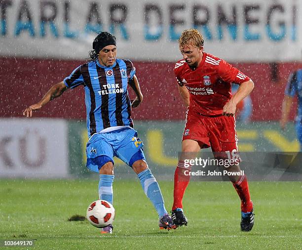 Dirk Kuyt of Liverpool competes with Gustavo Colman of Trabzonspor during the Europa League play off, 2nd leg match between Trabzonspor and Liverpool...