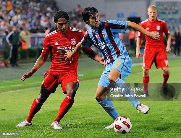 Glen Johnson of Liverpool competes with Hrvoje Cale of Trabzonspor during the Europa League play off, 2nd leg match between Trabzonspor and Liverpool...