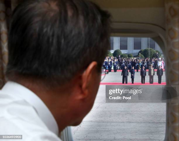 North Korea's leader Kim Jong Un and his wife Ri Sol Ju wave farewell to South Korean President Moon Jae-in at Moon's departure from North Korea at...