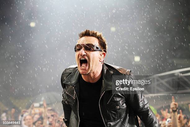 Lead singer Bono of Irish rock band U2 performs in the rain during their 360 Degree Tour at the Luzhniki stadium on August 25, 2010 in Moscow, Russia.