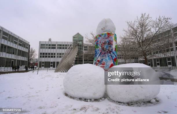 Three-metre tall sculpture made of snow resembling a phallus stands on the premises of the university of applied science in Kempten, Germany, 20...