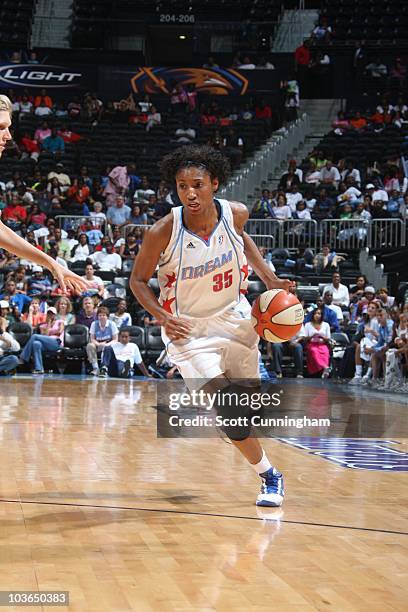 Angel McCoughtry of the Atlanta Dream moves the ball against the Seattle Storm at the Philips Arena on August 10, 2010 in Atlanta, Georgia. NOTE TO...
