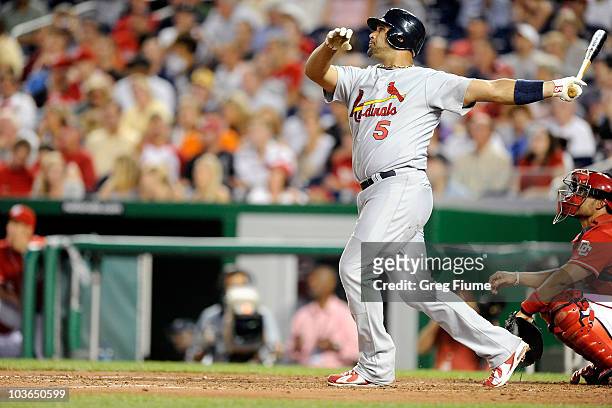 Albert Pujols of the St. Louis Cardinals hits a home run in the fourth inning against the Washington Nationals at Nationals Park on August 26, 2010...