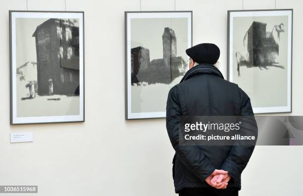 Visitor examines drawings by artist Klaus Bose at the exhibition venue 'Kunsthalle Harry Graf Kessler' in Weimar, Germany, 11 March 2015. Bose was...