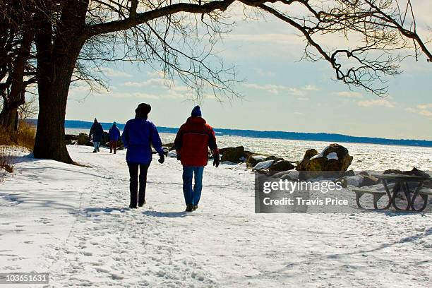 couple strolling on a crisp winter's day - stamford connecticut 個照片及圖片檔