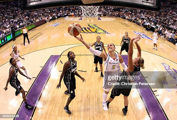Diana Taurasi of the Phoenix Mercury lays up a shot past Jayne Appel of the San Antonio Silver Stars in Game One of the Western Conference Semifinals...