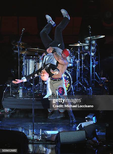 Musician Billy Corgan of the Smashing Pumpkins wrestles with a Mexican wrestler during the 2010 MTV World Stages concert at the Auditorio Nacional on...