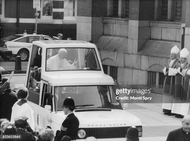 Pope John Paul II arrives at Westminster Cathedral in his modified Range Rover 'popemobile', on the first day of his visit to the UK, 28th May 1982....