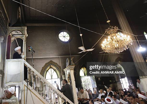 The Grand Mufti of Sunni Muslims in Lebanon, Mohammed Rashid Qabbani , delivers the Friday prayer sermon on August 27, 2010 at a partially burnt...