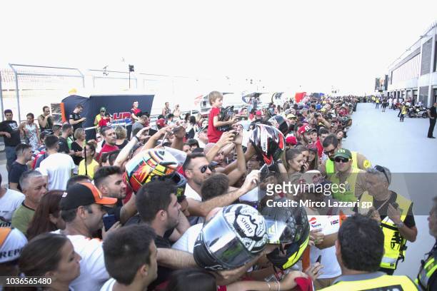 Marc Marquez of Spain and Repsol Honda Team signs autographs for fans during the pit walk during the MotoGP of Aragon - Previews at Motorland Aragon...
