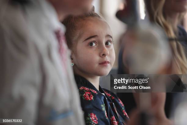 Eleven-year-old Sofia Sanchez listens as her doctors speak at a press conference, discussing her recent heart transplant at the Ann & Robert Lurie...