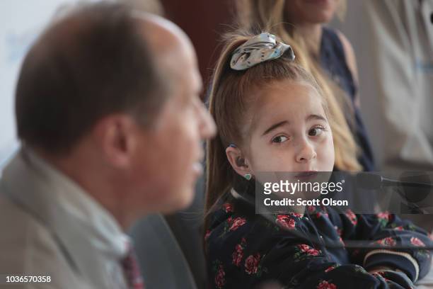 Eleven-year-old Sofia Sanchez listens as her doctors speak at a press conference, discussing her recent heart transplant at the Ann & Robert Lurie...