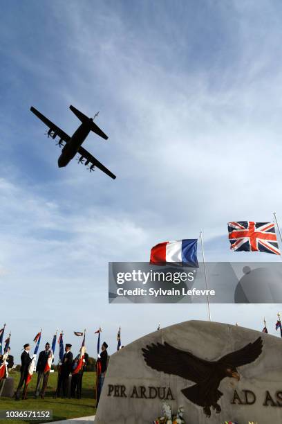 Lockheed Martin C-130J Super Hercules aircraft flies over during the commemoration of centenary of the Royal Air Force , at the Cemetery des...