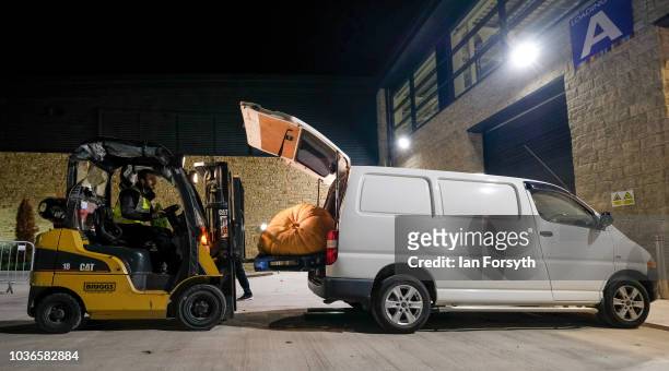 Giant pumpkin owned by Laura Litchfield and Chris Marriot from Mansfield is removed from the back of their van by fork lift as they prepare for the...