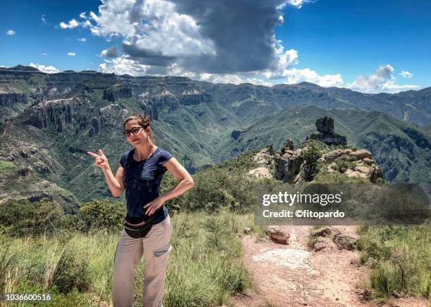 woman signaling the copper canyon - chihuahua mexico stock pictures, royalty-free photos & images