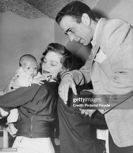 Actor Humphrey Bogart and his wife, actress Lauren Bacall, pictured with their son, Stephen Humphrey Bogart, USA, circa 1949.