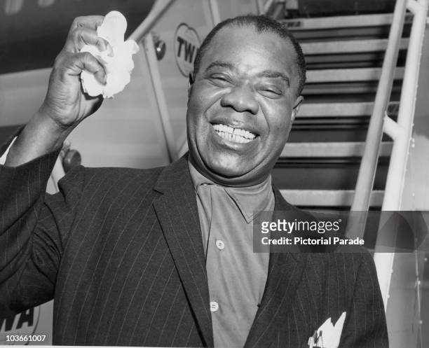 Jazz trumpeter and singer Louis Armstrong pictured at New York International Airport in New York, USA, 3 August 1961. Also known as 'Satchmo',...