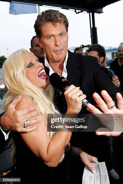 Actor David Hasselhoff and television presenter Daniela Katzenberger attend The Dome 55 on August 27, 2010 in Hannover, Germany.