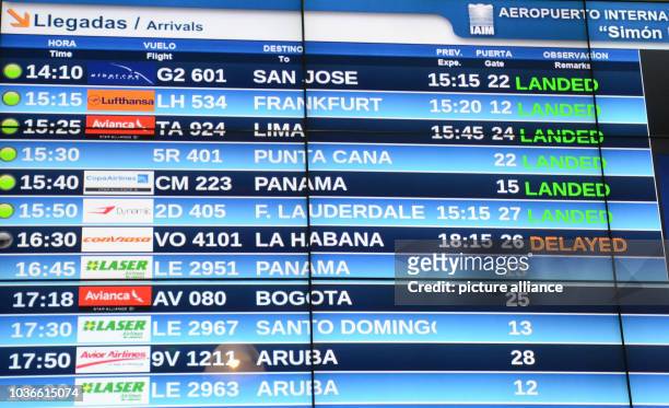 Arriving flights are shown on an electronic displays at the airport in Caracas, Venezuela, 13 June 2016. Starting 17 June 2016, Lufthansa will...