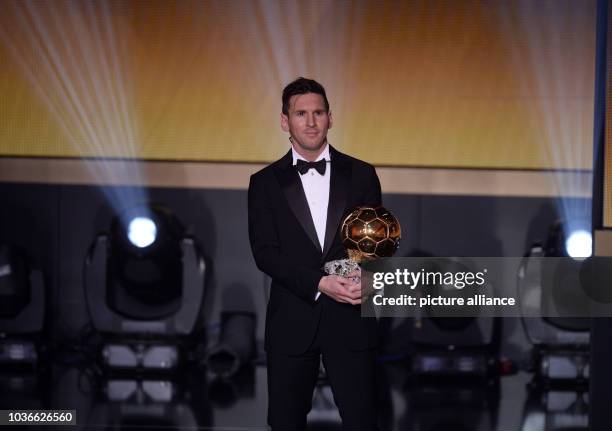 Argentina's Lionel Messi poses with his trophy after winning the FIFA Men's soccer player of the year 2015 prize during the FIFA Ballon d'Or Gala...