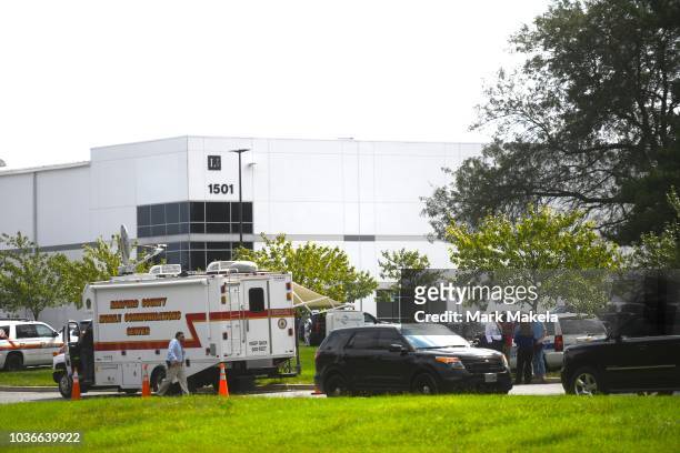 Police gather outside a Rite Aid Distribution Center, where multiple people were killed and injured in a shooting on September 20, 2018 in Aberdeen,...