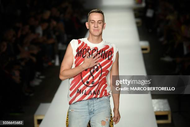 Fashion designer Jeremy Scott acknowledges applause following the presentation of the Moschino fashion collection during the Women's Spring/Summer...