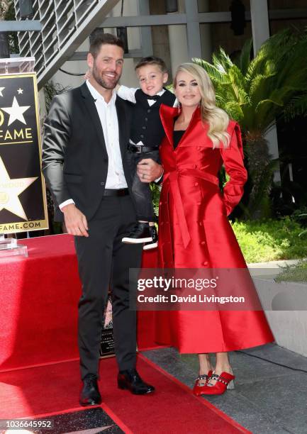 Mike Fisher and Isaiah Michael Fisher attend as Carrie Underwood is honored with a star on The Hollywood Walk of Fame on September 20, 2018 in...