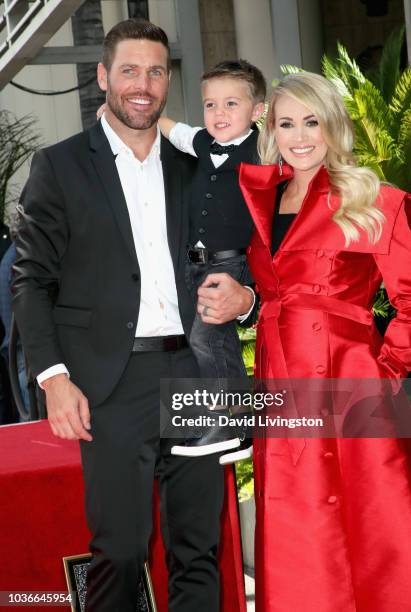 Mike Fisher and Isaiah Michael Fisher attend as Carrie Underwood is honored with a star on The Hollywood Walk of Fame on September 20, 2018 in...