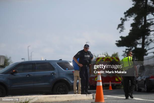 Police gather outside a Rite Aid Distribution Center, where multiple people were killed and injured in a shooting on September 20, 2018 in Aberdeen,...