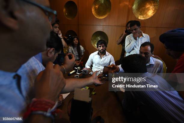 Wrestler Bajrang Puniya addresses the media during a press conference at Connaught Place, on September 20, 2018 in New Delhi, India. The wrestler...