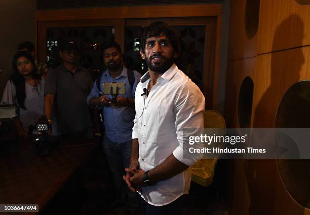 Wrestler Bajrang Puniya addresses the media during a press conference at Connaught Place, on September 20, 2018 in New Delhi, India. The wrestler...