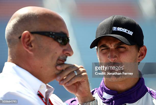 Graham Rahal driver of the NHR/Quicktrim Dallara Honda and his father Bobby Rahal during qualifying for the Indy Car Series PEAK Antifreeze and Motor...