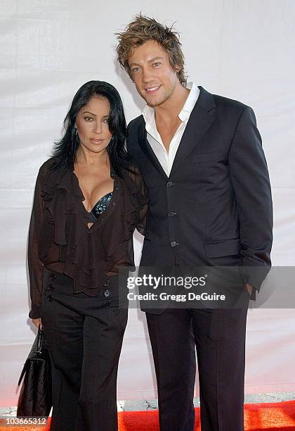 Actress/singer Apollonia Kotero and actor Emmanuel Delcour arrive at the 2007 World Magic Awards at the Barker Hanger on October 13, 2007 in Santa...