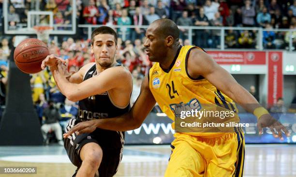 Bamberg's Daniel Schmidt veis for the ball with Berlin's Ali Traore during the Euroleague group E intermediate basketball round match between Brose...