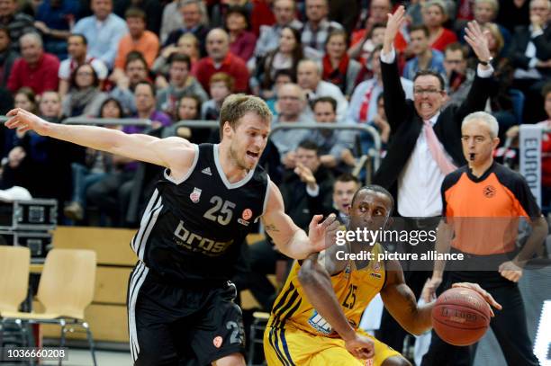 Bamberg's Anton Gavel vies for the ball with Berlin's Je'Kel Foster during the Euroleague group E intermediate basketball round match between Brose...