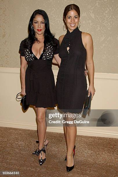 Actress/singer Apollonia Kotero and actress Ana Ortiz arrive at Project Angel Food's Divine Design Gala Awards dinner at the Beverly Hilton Hotel on...