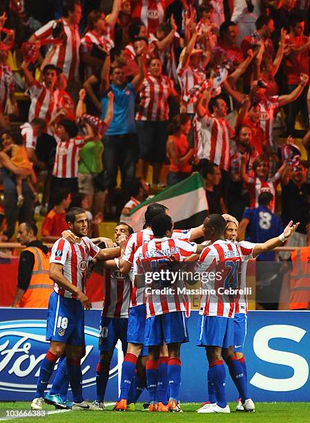 Players of Atletico de Madrid celebrate their team's opening goal scored by Josè Antonio Reyes during the UEFA Super Cup between FC Inter Milan and...