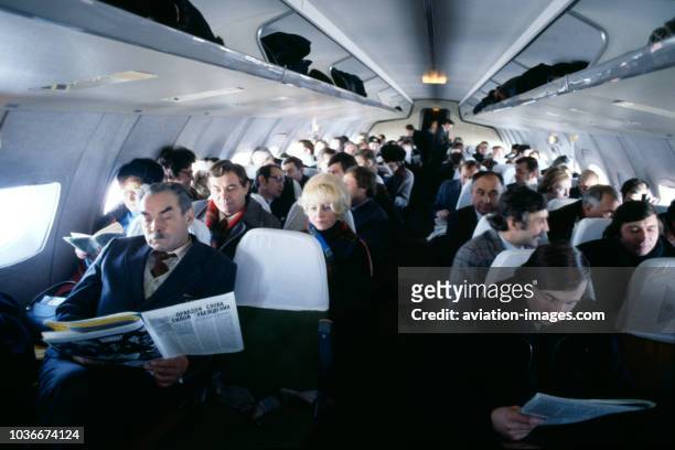 Passengers sit inside the Yakovlev YAK-42 of Aeroflot Soviet Airlines, USSR.