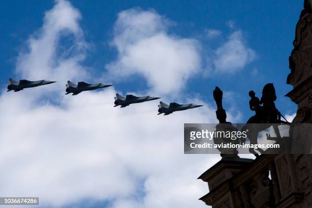 Four Mikoyan MiG-31military airplanes fly in formation over Moscow during a rehearsal for the Victory Day military parade to celebrate the 71st...