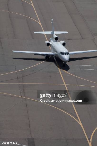 The Dassault Falcon 900 executive jet airplane seen on a taxiway of Sheremetyevo Airport, Moscow, Russia.