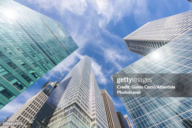 bank of america tower and others building around bryant park - midtown stock pictures, royalty-free photos & images