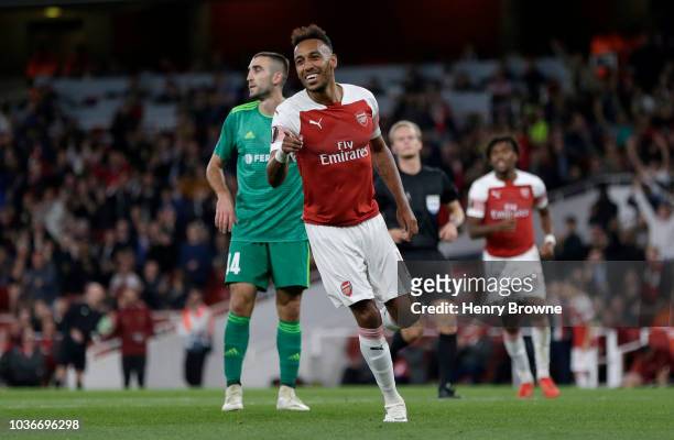 Pierre-Emerick Aubameyang of Arsenal celebrates after scoring his team's third goal during the UEFA Europa League Group E match between Arsenal and...