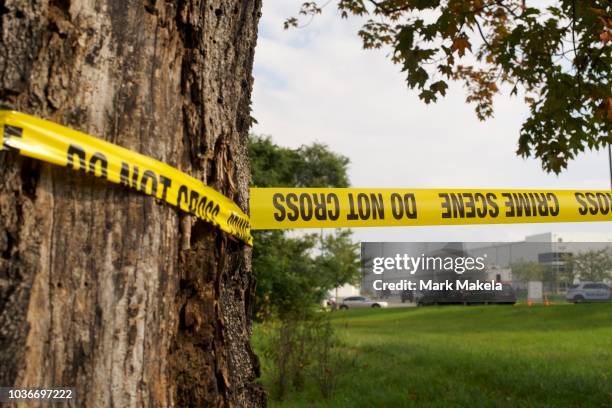 Crime scene tape flutters in the wind in front of a Rite Aid Distribution Center, where multiple people were killed and injured in a shooting on...