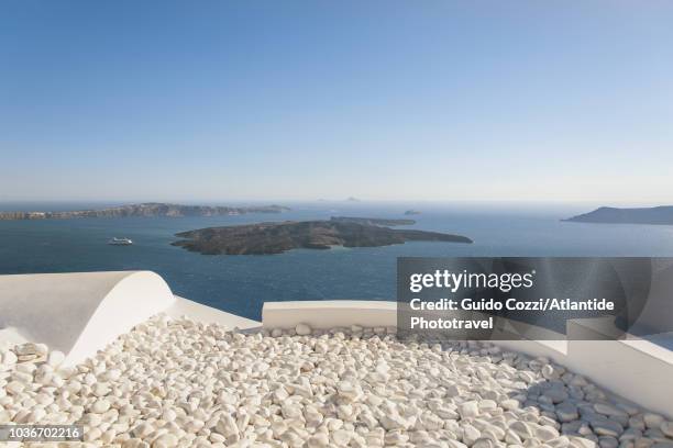 nea kameni volcano and santorini caldera view from fira - santorini volcano stock pictures, royalty-free photos & images