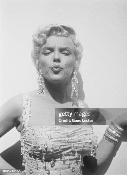 American actress Marilyn Monroe wearing a beaded gown on the set of 'There's No Business Like Show Business', directed by Walter Lang, at the 20th...